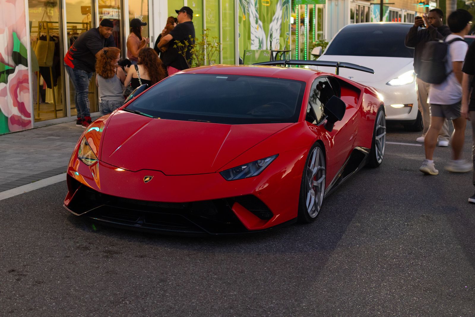 Red supercar front end protected by clear full front film