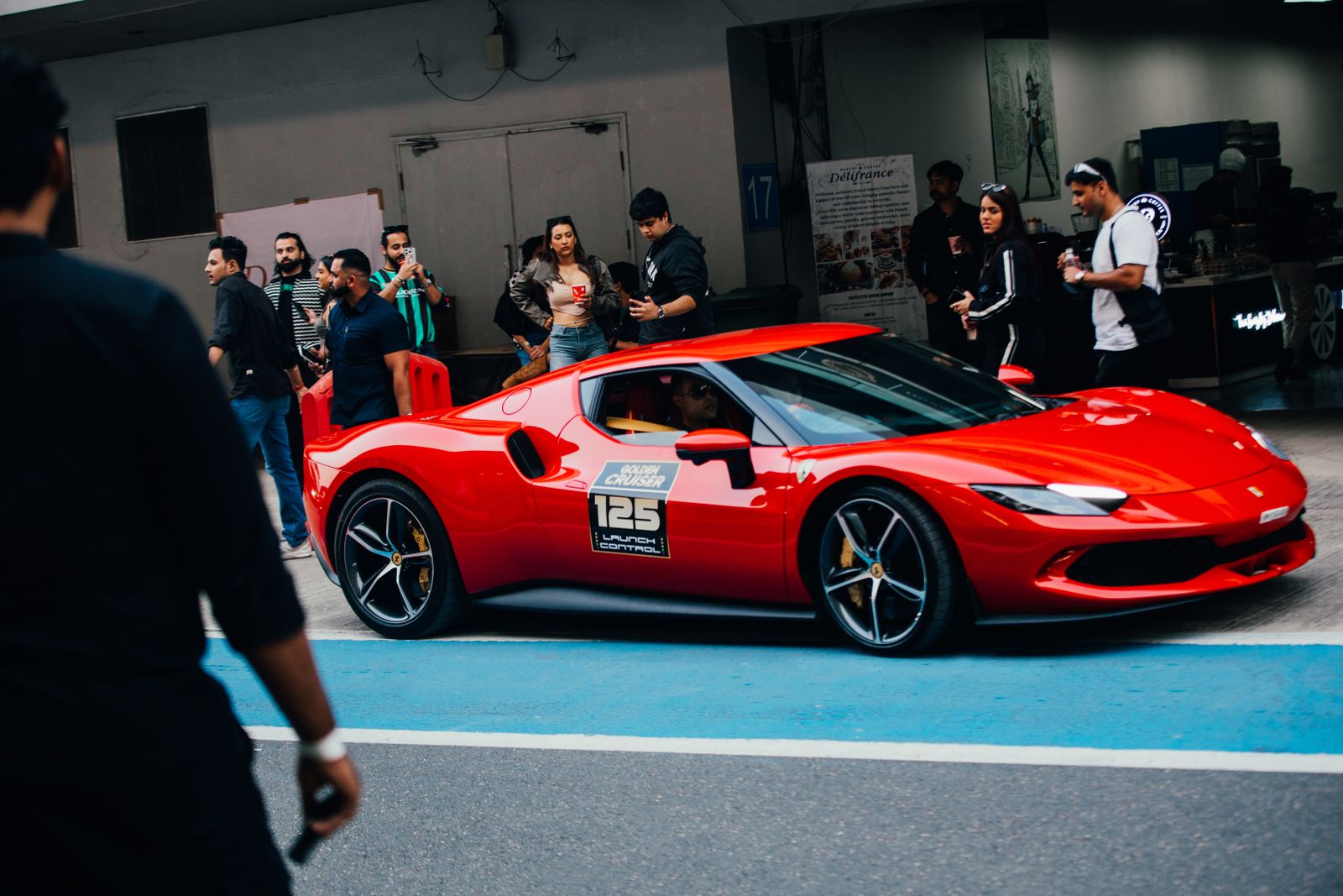 Red sports car at an automotive event
