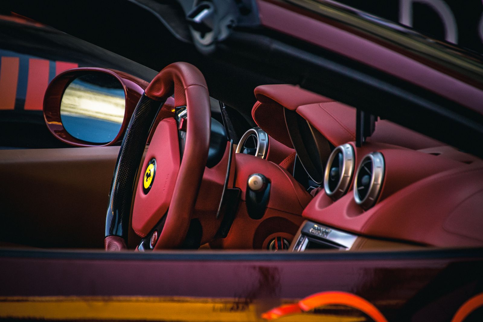 Red leather sports car interior after detailing