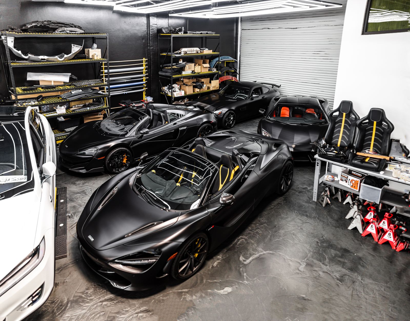 Three sports cars in a clean private garage